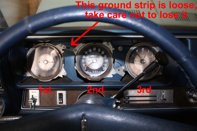 The instrument panel with trim removed, showing screw location.  1970 Cutlass Supreme.