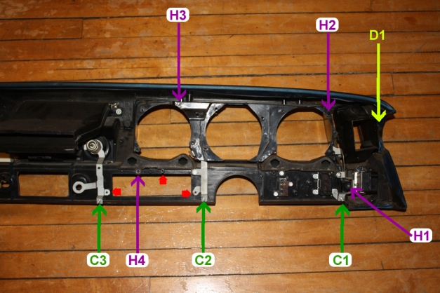 View of an Oldmobile A-body dashboard from behind, showing location of various screw attachment points.